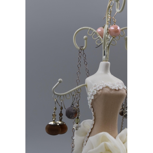 70 - Figural Jewellery Stand with selection of Earrings, and Chain