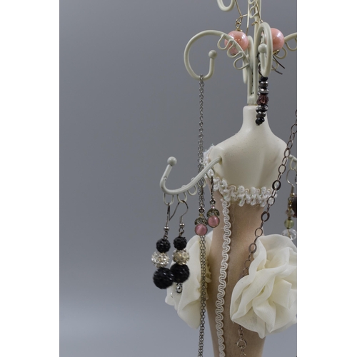 70 - Figural Jewellery Stand with selection of Earrings, and Chain