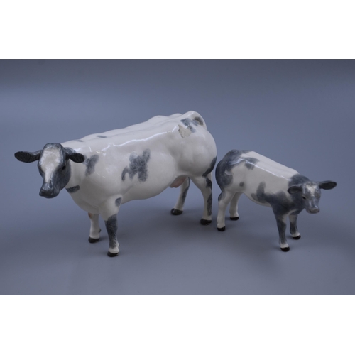 168 - A Pair Border Fine Arts Belgian Blue Bull and Calf Ceramic Figures, With Boxes (A4579 and A4585)