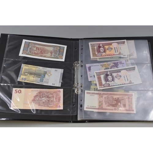 223 - Folder Containing a Large Selection of Uncirculated Worldwide Banknotes. Includes Laos, Congo, Malaw... 