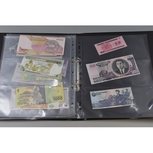 223 - Folder Containing a Large Selection of Uncirculated Worldwide Banknotes. Includes Laos, Congo, Malaw... 