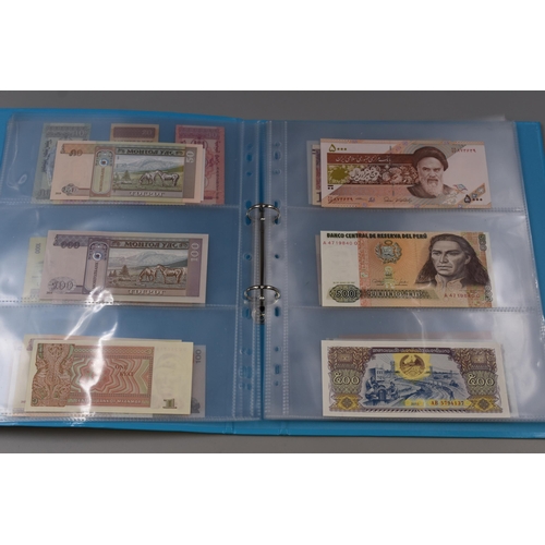 224 - Folder Containing a Large Selection of Uncirculated Worldwide Banknotes. Includes Indonesia, Ukraine... 