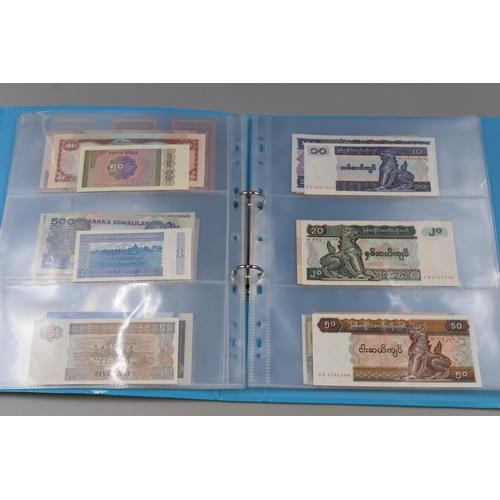 224 - Folder Containing a Large Selection of Uncirculated Worldwide Banknotes. Includes Indonesia, Ukraine... 