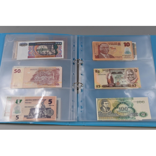 224 - Folder Containing a Large Selection of Uncirculated Worldwide Banknotes. Includes Indonesia, Ukraine... 