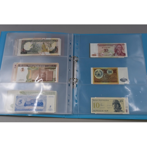 224 - Folder Containing a Large Selection of Uncirculated Worldwide Banknotes. Includes Indonesia, Ukraine... 