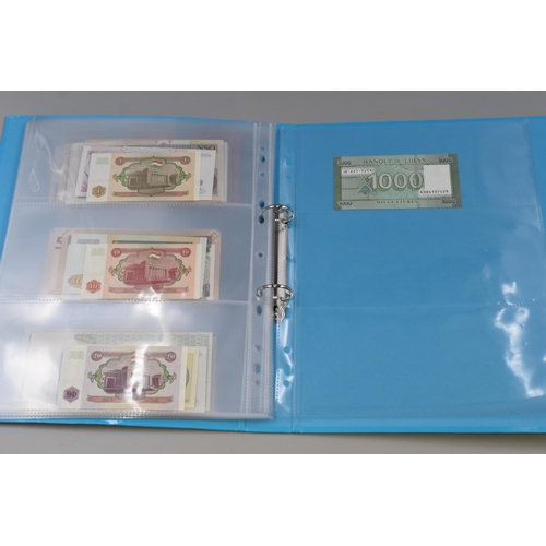 224 - Folder Containing a Large Selection of Uncirculated Worldwide Banknotes. Includes Indonesia, Ukraine... 