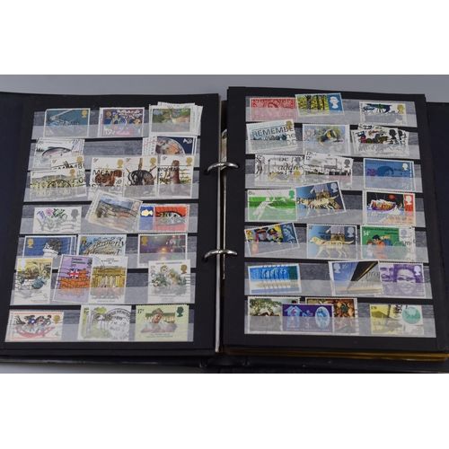 360 - Two Stamp Albums Containing a Selection of Mint and Postmarked British and Isle of Man Stamps