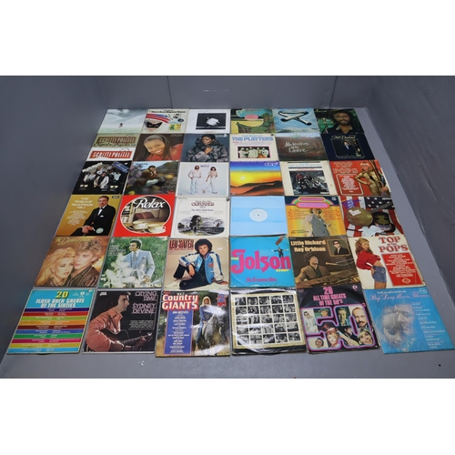 398 - A Selection of Vinyl LP's To Include Robert Plant, Hawkwind, Mike Oldfield, Paul Simon, Masashi Sada... 