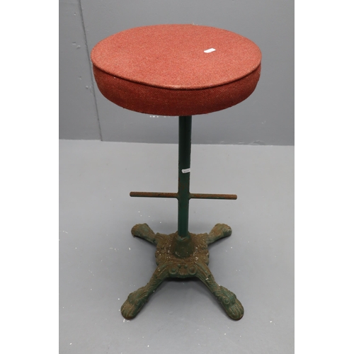 516 - A Vintage Cast Base Bar Stool With Red Fabric Covered Top. Approx 29