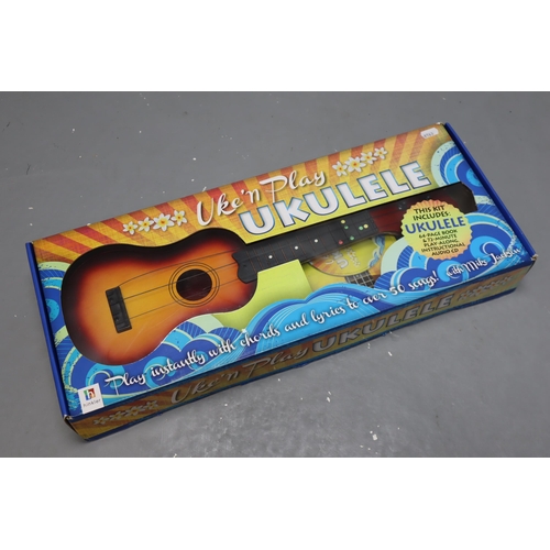 444 - Boxed Uke and Play Ukulele Learn to Play Kit complete with Ukulele, Learning Booklet and Cd Disk. AF