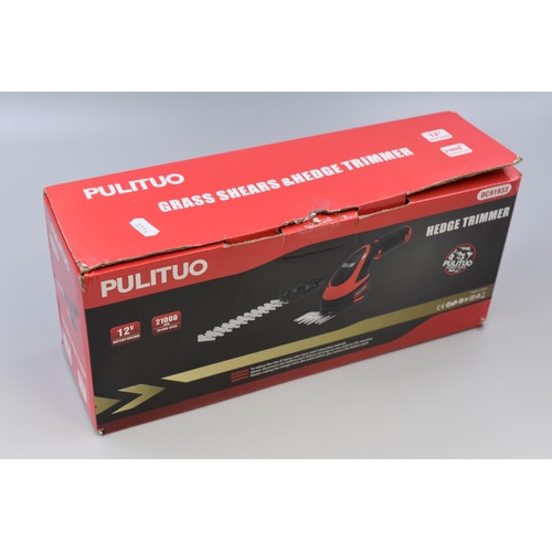 545 - A Boxed Pulituo 12v Cordless Hedge/Grass Trimmer. Includes Grass Shear and Hedge Trimmer Attachment,... 