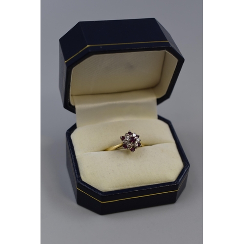 11 - A Hallmarked London 18ct Gold Diamond and Ruby Cluster Ring, With Presentation Box. 3.69g (Size R)