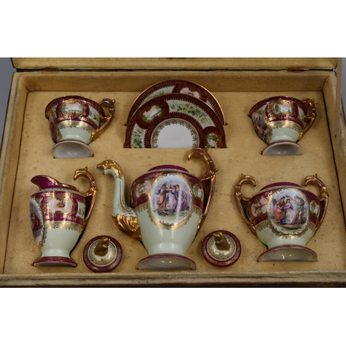 316 - Royal Vienna Tete-a-tete 19th Century Porcelain Tea Set finished in Burgundy and Gilt with Beehive m... 