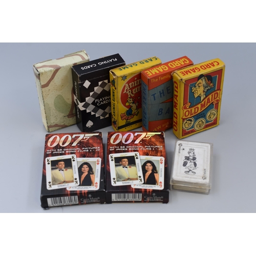 406 - Eight Packs of Playing Cards including James Bond, Old Maid, Animal Rummy and More