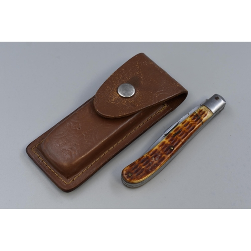 201 - A Horn Handled Fishing Knife, With Multi-Tool In Leather Pouch