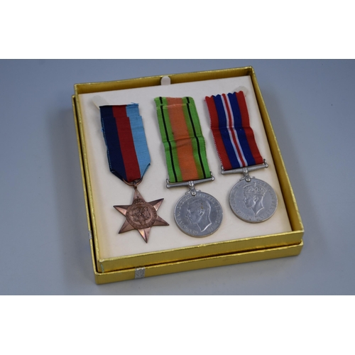 235 - Three WWII Medals to include 1939-1945 Star and War and Defence Medals