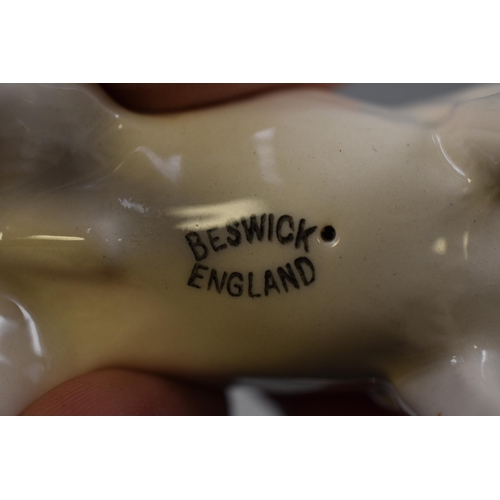 255 - Two Beswick Dog Figures. Includes Sheepdog and Jack Russell