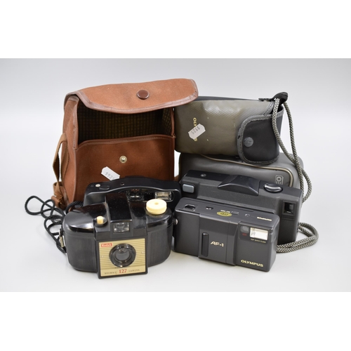 546 - Four vintage cameras to include LOREO, Olympus AF1, Pentax PC-50 and Kodak Brownie 127 all untested