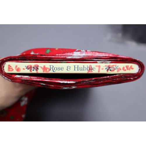 561 - Approx 13mtrs of Red Coloured Christmas Collection Rose and Hubble Patterned Quality Fabric