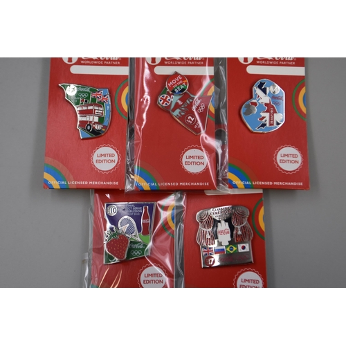 622 - Five Boxes of 10 Official Coca Cola Olympics Day Badges (Day 2, 4, 7, 10, & 17)