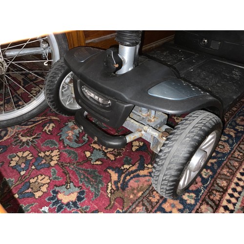 677 - TGA Eclipse mobility scooter in black, good condition with charger, working when tested