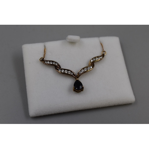 16 - Gold 375 (9ct) Blue and Clear Stoned Pendant Necklace Complete with Presentation Box