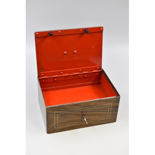 294 - Heavy (3.8Kg) steel locking strong box with key, wood effect exterior finish with red interior