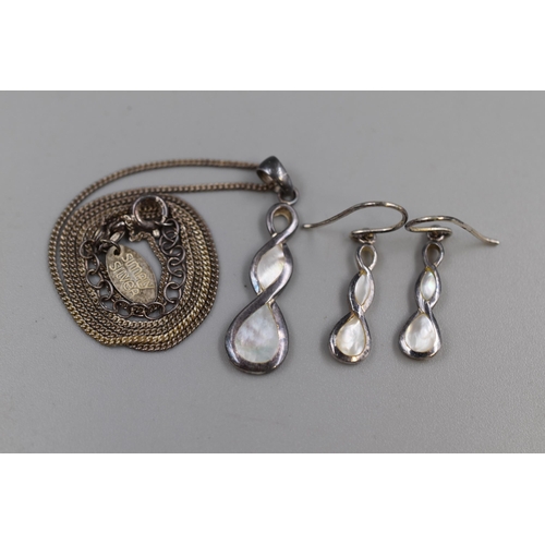 53 - A Sterling Silver and Mother of Pearl 925. Silver Pendant Necklace and Earring Set