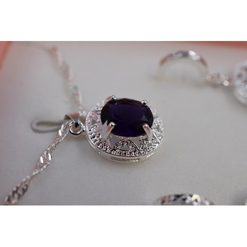 59 - A Purple Stoned 925. Silver Pendant Necklace, With Pair of Matching 925. Silver Earrings