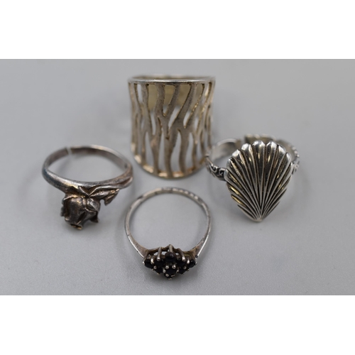 63 - Four 925. Silver Rings To Include Seashell Ring, Rose Ring, And More