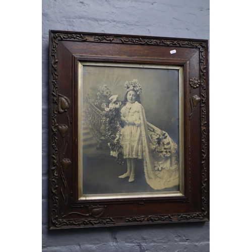 329 - A vintage photograph of a young lady in a glazed, dark wood, arts and crafts frame 29