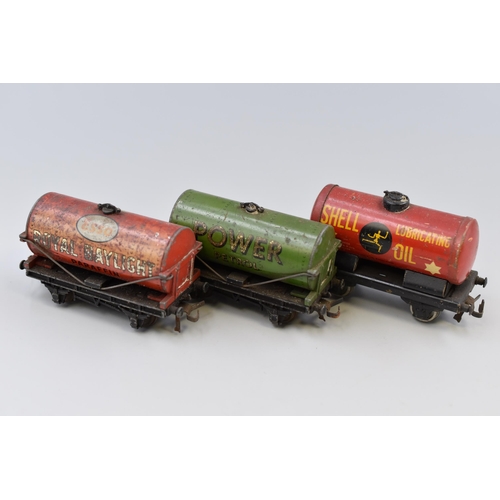 143 - Three Hornby fuel tanker trucks Power petrol, Esso Royal Daylight, Shell lubricating oil