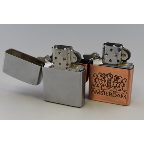 170 - Two Collectable Lighters To Include Copper Effect Amsterdam Lighter, And Silver Tone Zippo Lighter