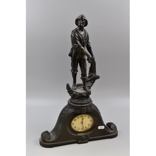 193 - Spelter fisherman clock/figurine measures 19