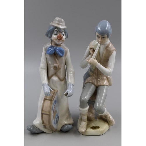 251 - Pair of Casades porcelain Statues to include a Flute Player and a Circus Clown a/f approx 9.5