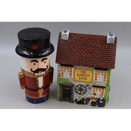 261 - Two Ceramic Cookie Jar Storage Containers in the form of a Soldier and a Cottage (slight chip to cot... 