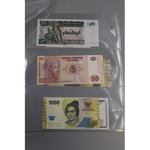 102 - Eight Uncirculated Worldwide Banknotes. Includes Madagascar, Tajikistan, Myanmar, Congo, Indonesia a... 