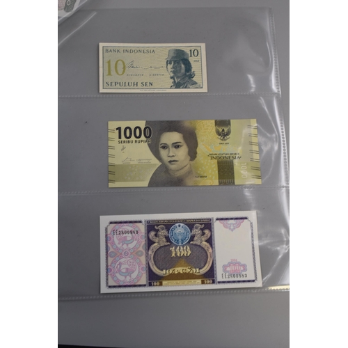 102 - Eight Uncirculated Worldwide Banknotes. Includes Madagascar, Tajikistan, Myanmar, Congo, Indonesia a... 