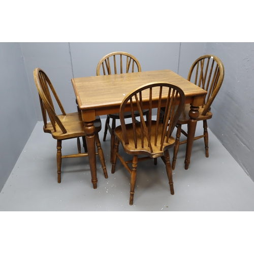 609 - An Oak Dining Table With A Set of Four Spindle Backed Dining Chairs. Table Is Approx 26