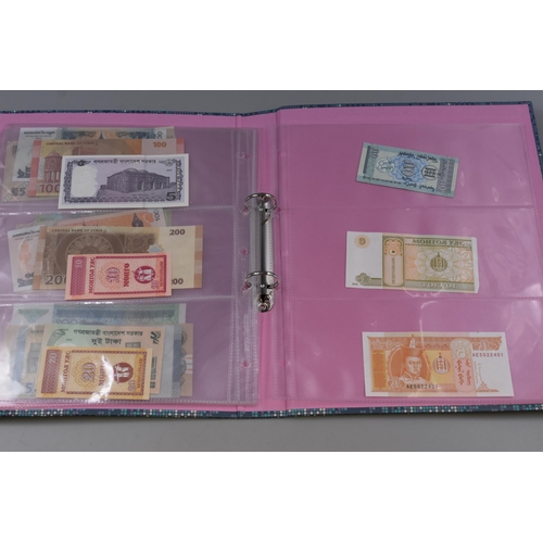 173 - Folder to include a Selection of Uncirculated Banknotes. Includes Indonesia, Uzbekistan, Nigeria, Gu... 