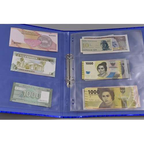 194 - Folder to include a Selection of Uncirculated Worldwide Banknotes. Includes Madagascar, Malawi, Indo... 