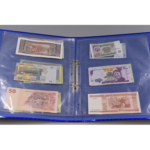 194 - Folder to include a Selection of Uncirculated Worldwide Banknotes. Includes Madagascar, Malawi, Indo... 