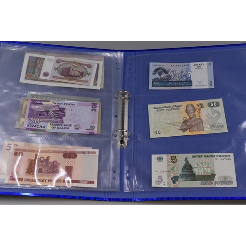 194 - Folder to include a Selection of Uncirculated Worldwide Banknotes. Includes Madagascar, Malawi, Indo... 