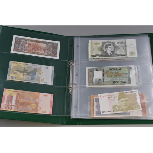 195 - Album Containing a Large Selection of Uncirculated Worldwide Bank Notes. Includes Syria, Pakistan, Z... 