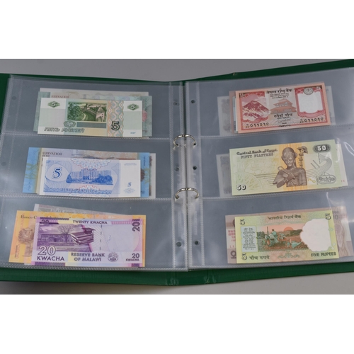 195 - Album Containing a Large Selection of Uncirculated Worldwide Bank Notes. Includes Syria, Pakistan, Z... 