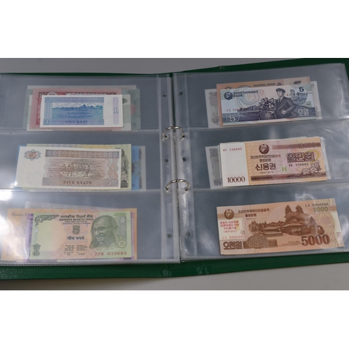 195 - Album Containing a Large Selection of Uncirculated Worldwide Bank Notes. Includes Syria, Pakistan, Z... 