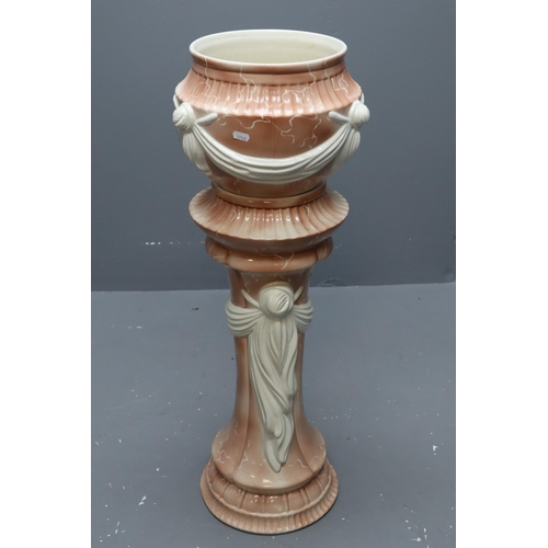 645 - A Classical Style Pink Marble Effect Ceramic Jardinere With Stand. Approx 35.5