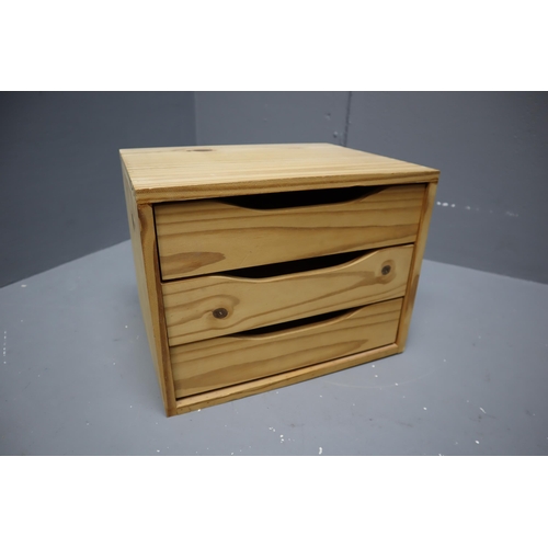 649 - Three drawer pine storage unit measures 15