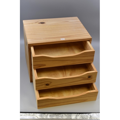 649 - Three drawer pine storage unit measures 15