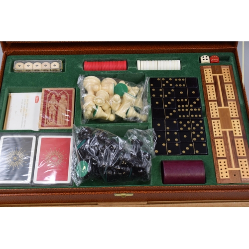 652 - A Cased Games Set. Includes Playing Cards, Chess, Checkers, Bridge and More